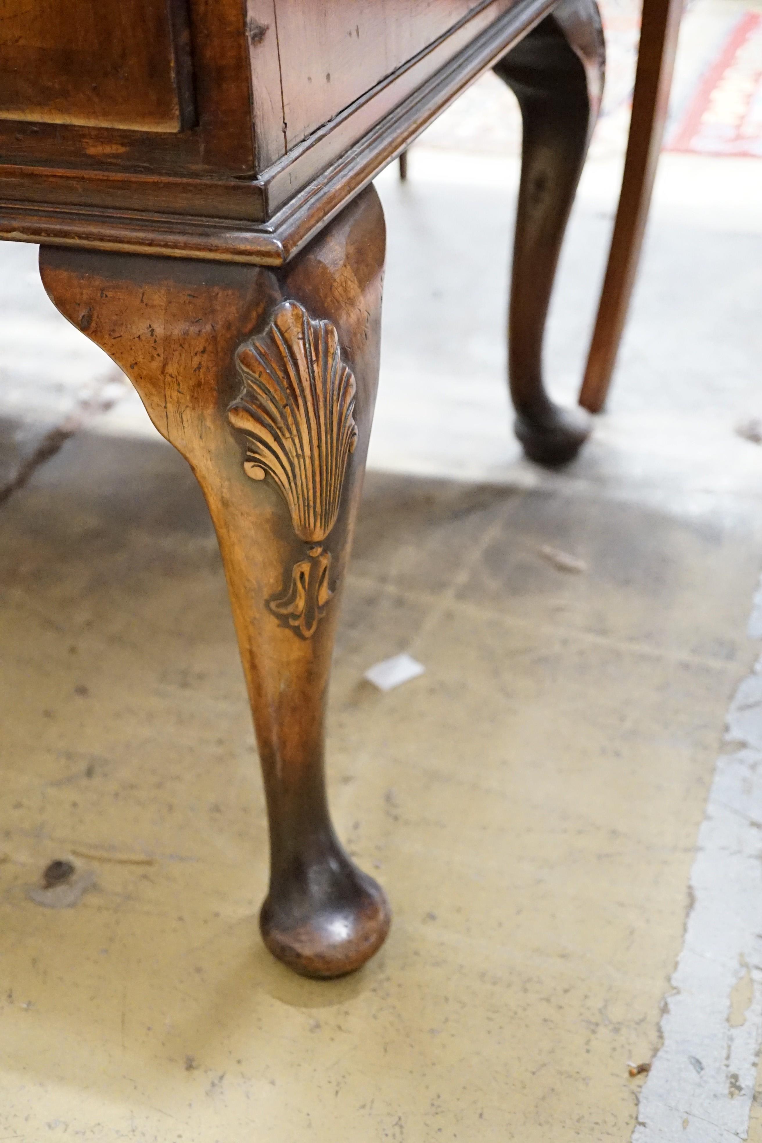 A Queen Anne style walnut chest of three drawers on cabriole legs, width 111cm, depth 56cm, height 83cm